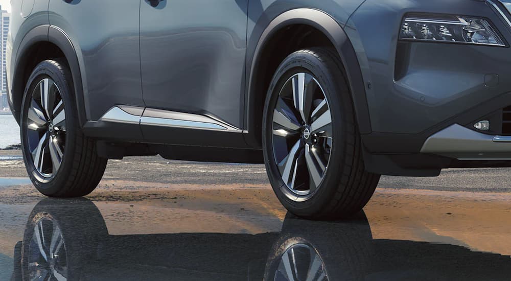 A grey 2021 Nissan Rogue is shown from a low angle after leaving a Nissan Rogue dealership.