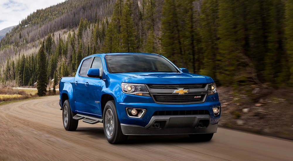 A blue 2020 Chevy Colorado is shown from the front after leaving a used Chevy dealer.