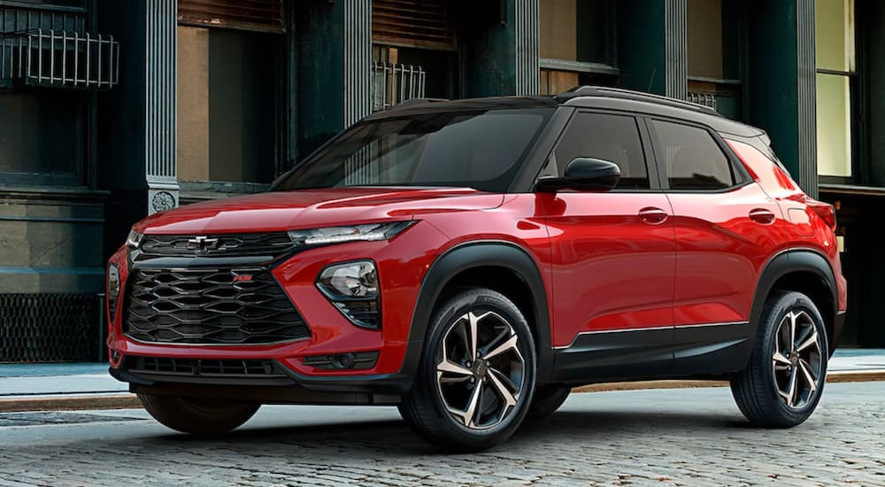 A red 2022 Chevy Trailblazer RS is shown from the side parked in a city.