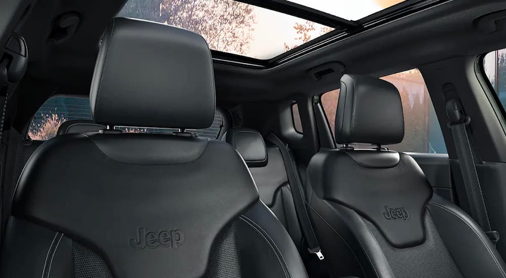 A close up shows the black leather seats of a 2022 Jeep Compass.