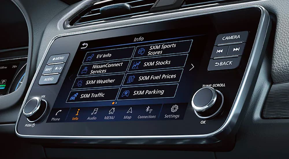 A close up shows the infotainment screen of a 2022 Nissan LEAF.