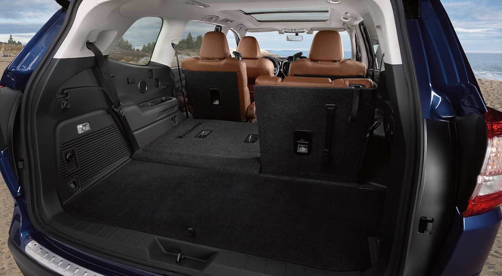 The rear cargo area of a 2022 Subaru Ascent shows a folded third row seat.