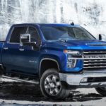 A blue 2022 Chevy Silverado HD is shown from the side after leaving a New Jersey truck dealer.