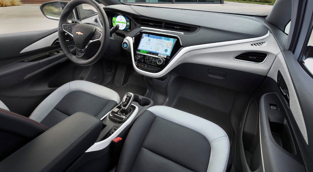 The black and grey interior of a 2018 Chevy Bolt EV is shown.