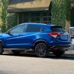 A blue 2022 Honda HR-V is shown parked on the side of a street.
