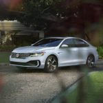 A white 2022 Volkswagen Passat is shown parked in a driveway.