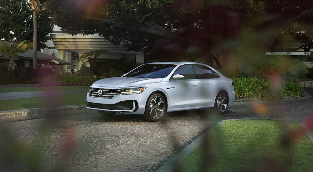 A white 2022 Volkswagen Passat is shown parked in a driveway.