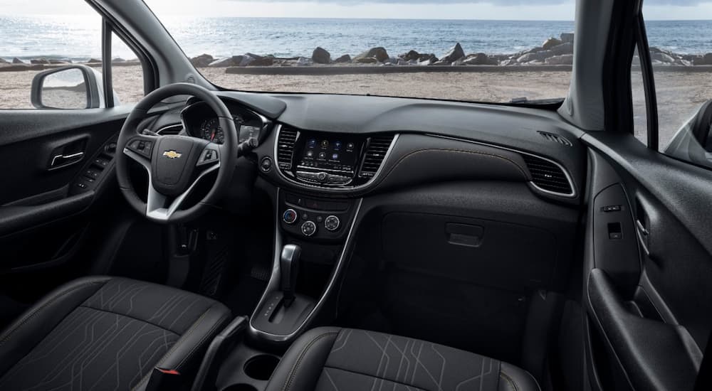 The black interior of a 2021 Chevy Trax is shown during a Chevy end of lease cleaning.