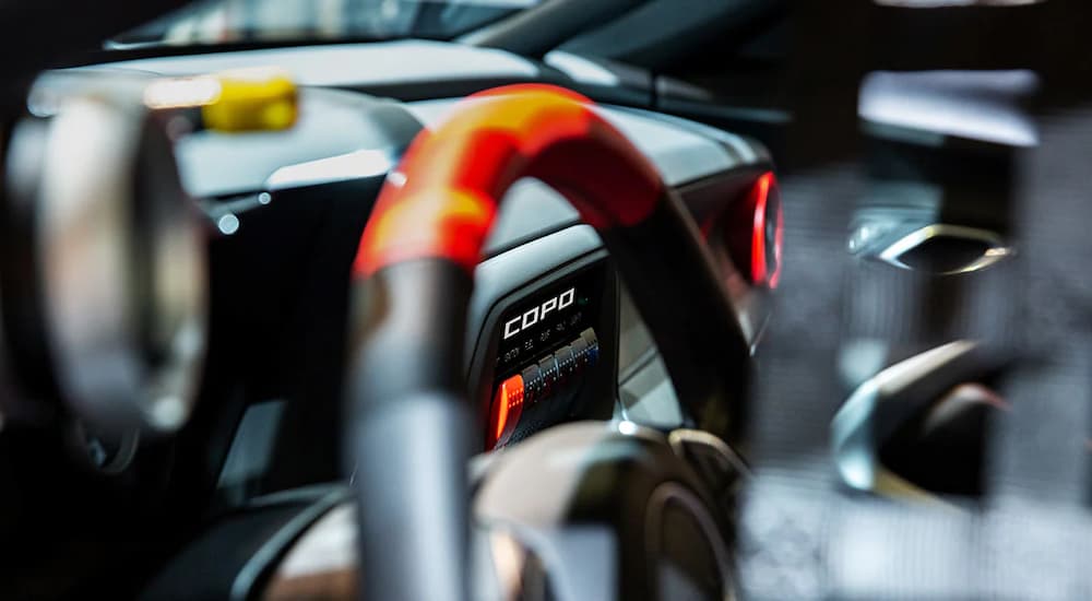 The black and orange accented interior of a 2022 Chevy Camaro COPO is shown.