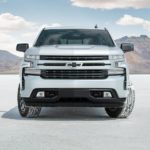 A silver 2022 Chevy Silverado 1500 RST LTD is shown from the front parked on white sand.