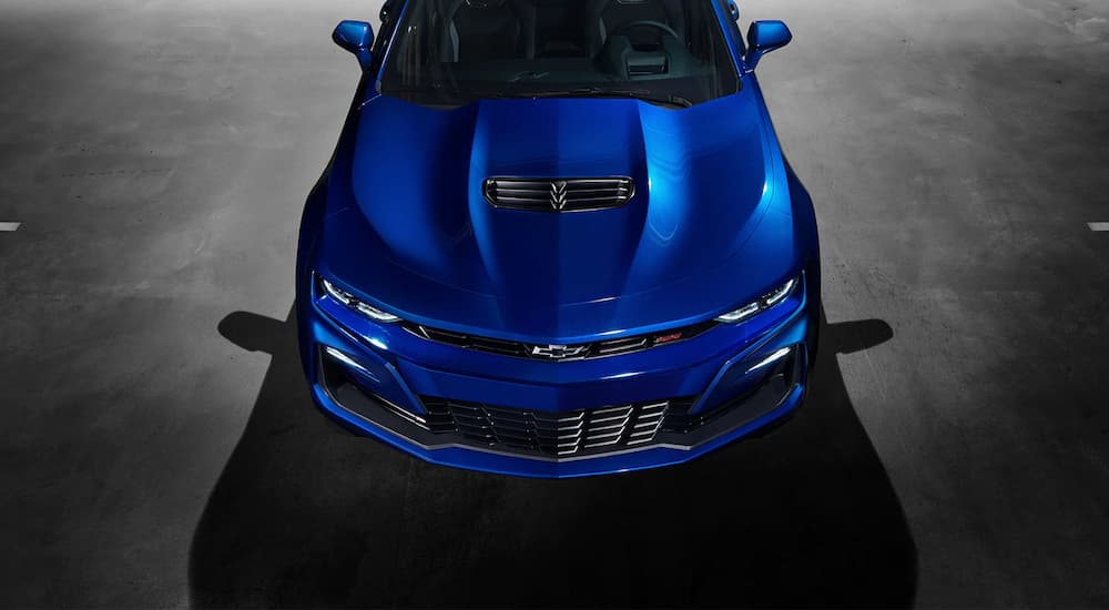 The front of a blue 2022 Chevy Camaro SS is shown from a high angle.
