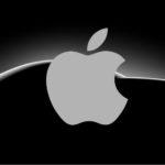 The Apple logo is shown on top of a dark silhouette of a car.