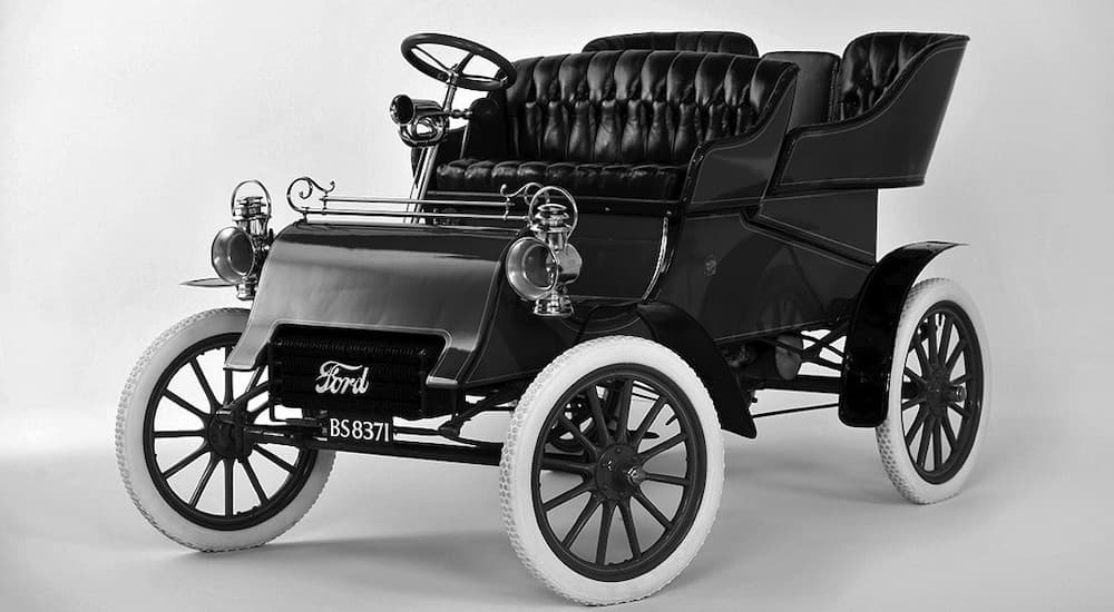 A black 1903 Ford Model A is angled left.