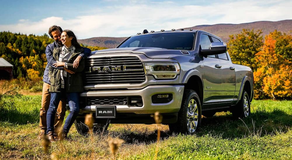 A silver 2022 Ram 2500 is shown parked in a field after leaving a Ram 2500 dealership.