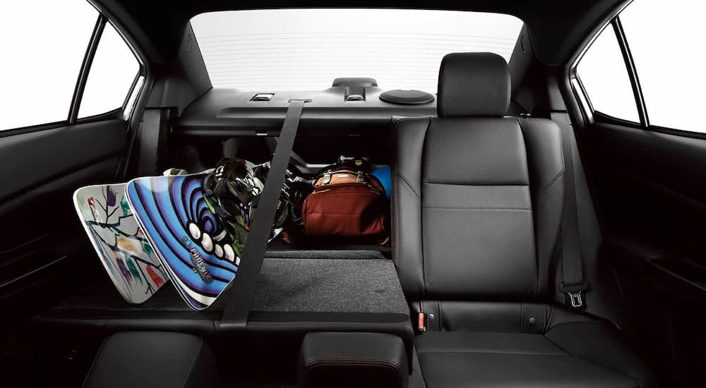 The rear folding seats and cargo area of a 2021 Subaru WRX are shown at a Subaru WRX dealer.