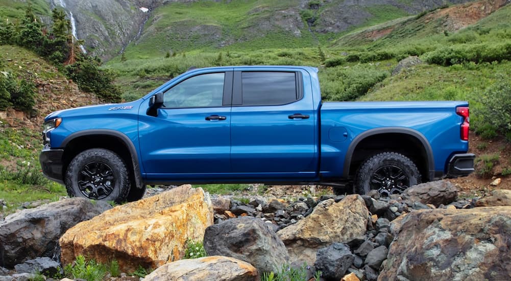 A blue 2022 Chevy Silverado 1500 ZR2 is shown from the side parked in the mountains.