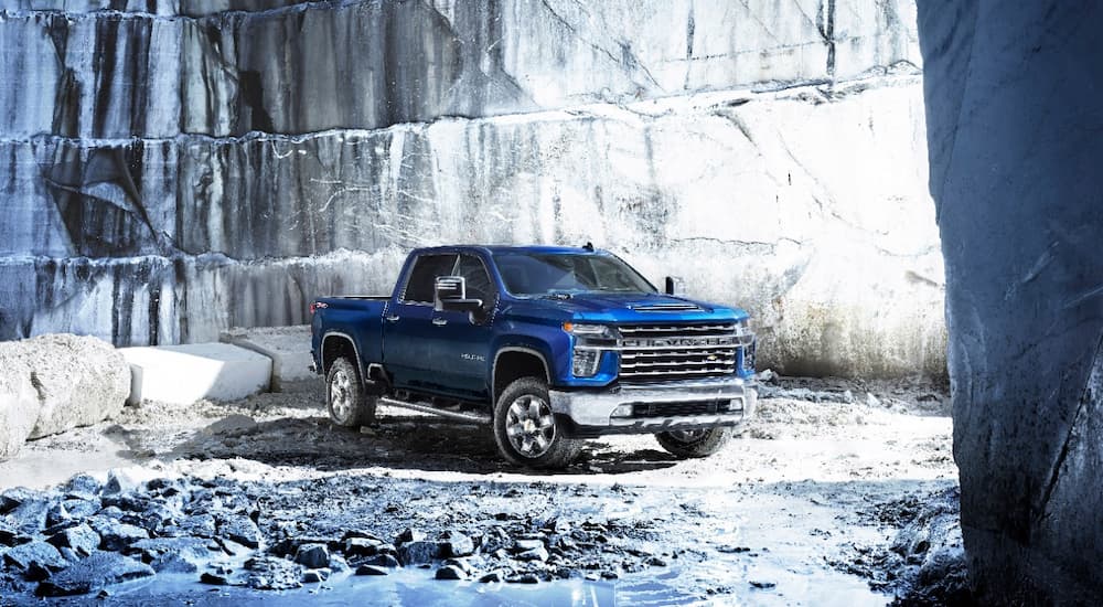 A blue 2022 Chevy Silverado 2500 HD is shown parked in a quarry.