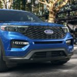 A blue 2022 Ford Explorer ST is shown from a low angle parked in a driveway.