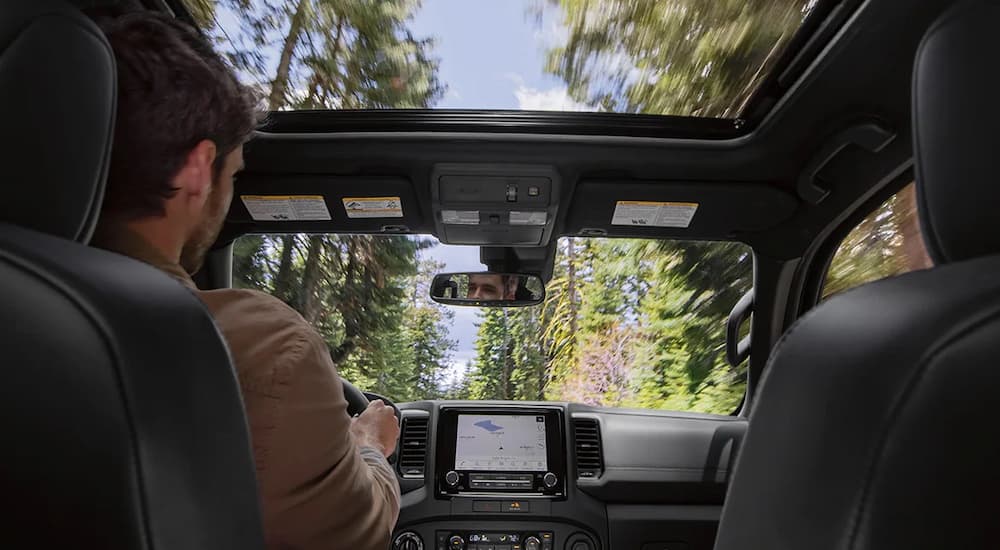The interior of a 2022 Nissan Frontier shows the moonroof.