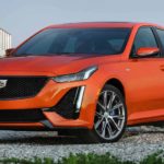 An orange 2022 Cadillac CT5-V is shown parked after doing research on "how to sell my car."