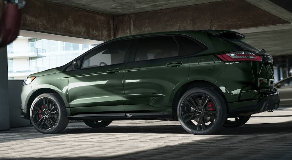 A green 2022 Ford Edge is shown from the side parked in a parking garage.