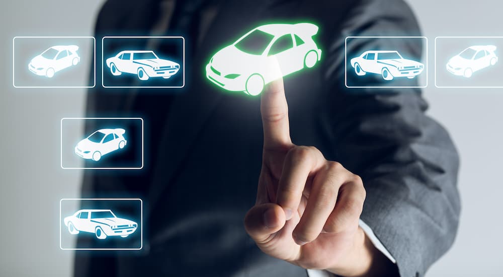 A person is shown selecting a vehicle a car icon.