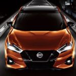 An orange 2022 Nissan Maxima is shown from the front after leaving a Nissan dealer in Leduc.