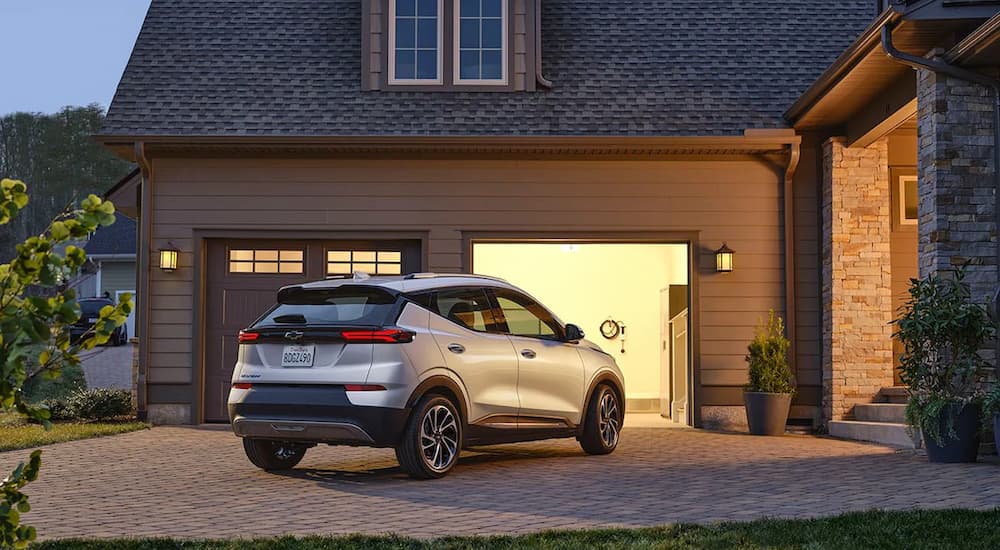 A silver 2022 Bolt EUV is shown parked in a driveway.