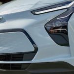 A close up of the front of a light gray 2022 Chevy Bolt EV is shown.