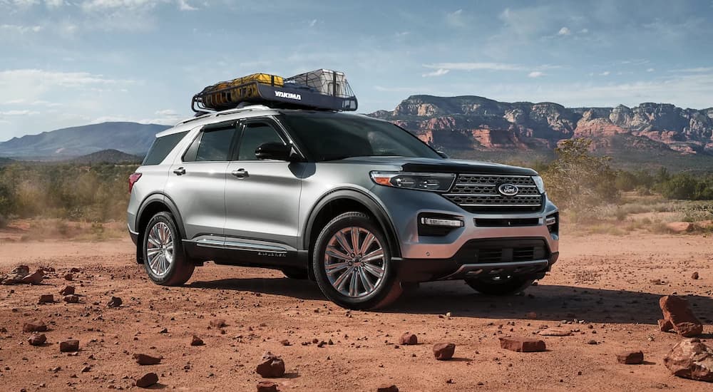 A silver 2022 Ford Explorer is shown parked on the dirt after a 2022 Ford Explorer vs 2022 Honda Pilot competition.