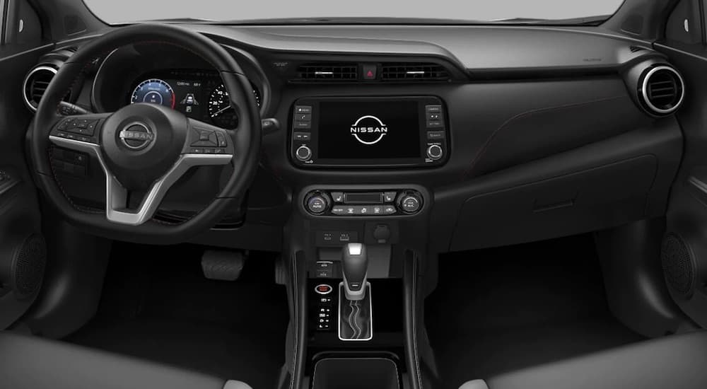The interior of a 2022 Nissan Kicks is shown from above the center console facing the dash.