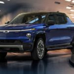 A blue 2022 Chevy Silverado EV is shown angled left at a Chevy dealer.