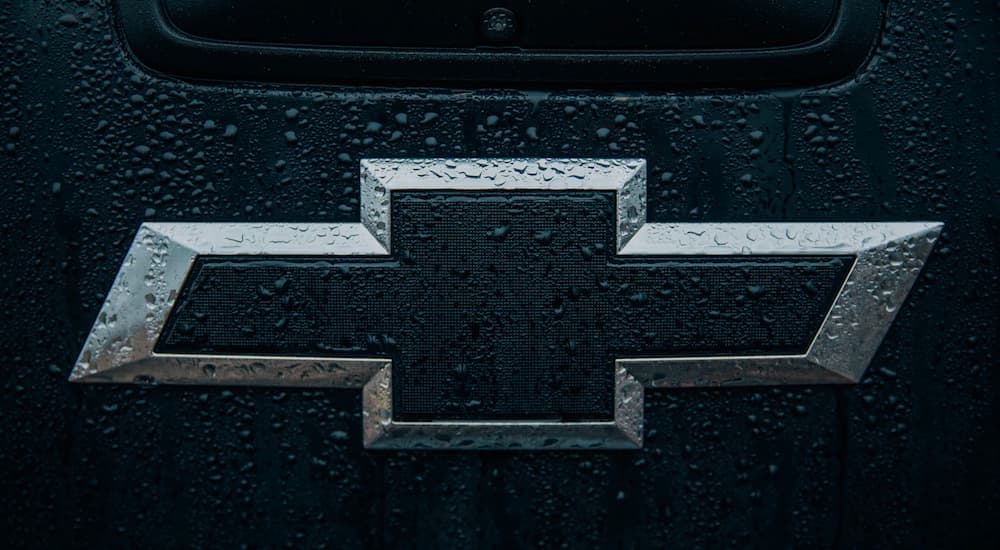 A black Chevy logo is shown in close up.