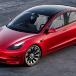A red 2022 Tesla Model 3 is shown from above.