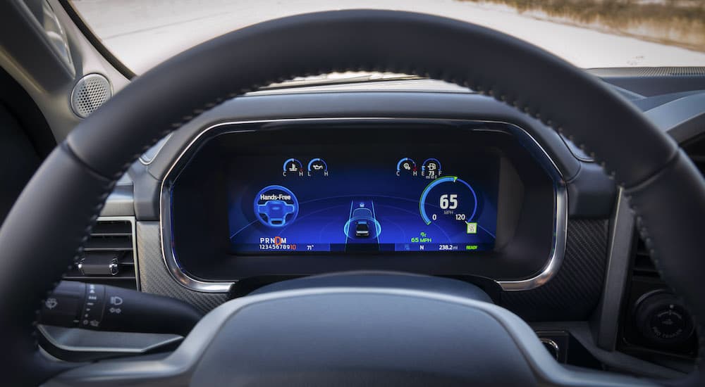 The black interior of a Ford shows BlueCruise in close up.