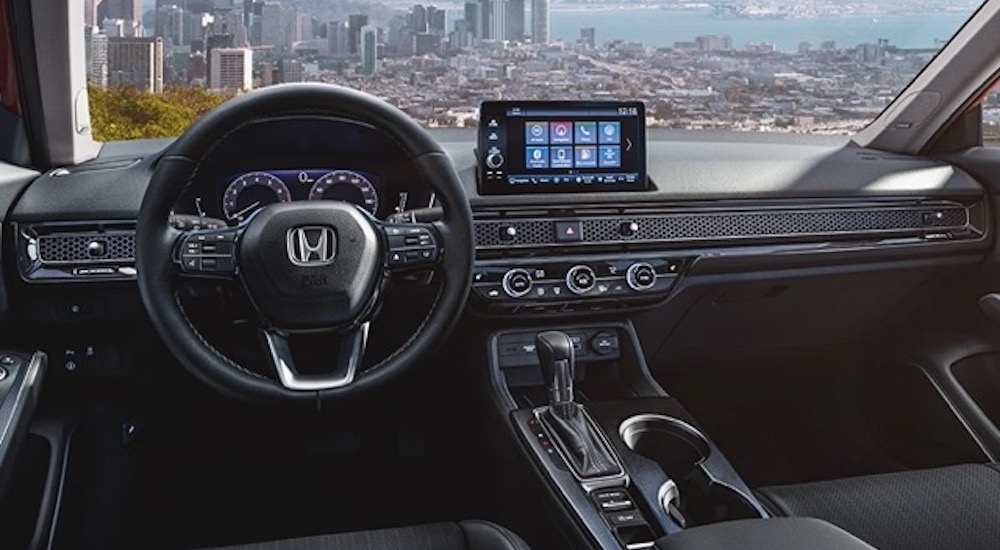 The interior of a 2022 Honda Civic is shown from the drivers seat.