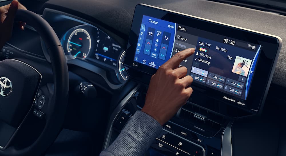 The interior of a 2022 Toyota Venza is shown from the passenger seat showing the center display.