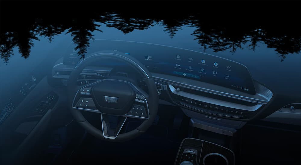 The black interior of a 2023 Cadillac Lyriq is shown through the moonroof.