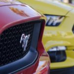 A close up shows a row of 2017 Ford Mustangs at a Certified Pre-Owned Ford dealership.