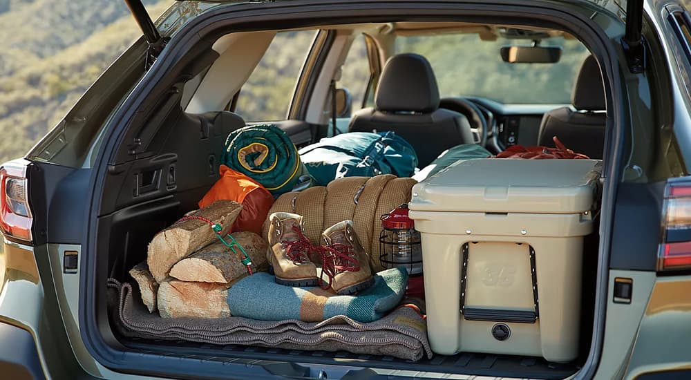 A close up of camping gear is shown in the back of a 2022 Subaru Outback.