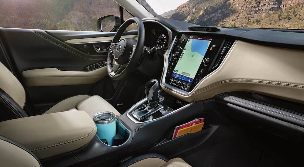 The front seats and dash are shown in a 2022 Subaru Outback Limited.