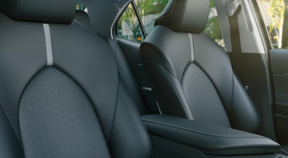 A close up of the black leather front seats of a 2022 Toyota Camry is shown.