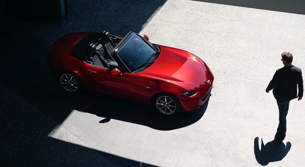 A red 2022 Mazda MX-5 Miata is shown from above.