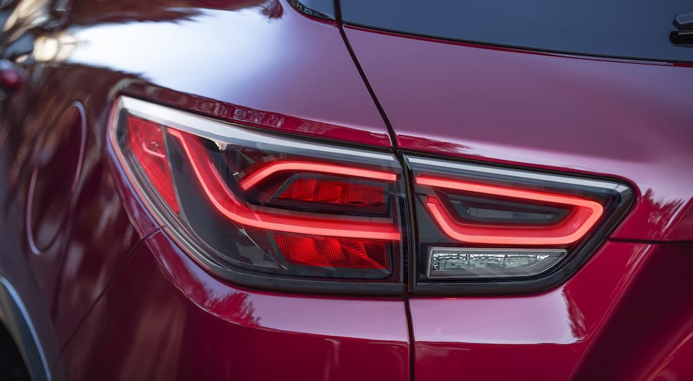 A close up shows the driver side taillight on a red 2023 Chevy Blazer RS.