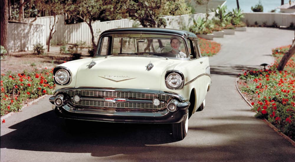 A white 1957 Chevy Bel Air is shown from the front after leaving a Chevrolet dealer.