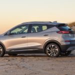 A silver 2022 Chevy Bolt EUV is shown from the side parked on a beach.