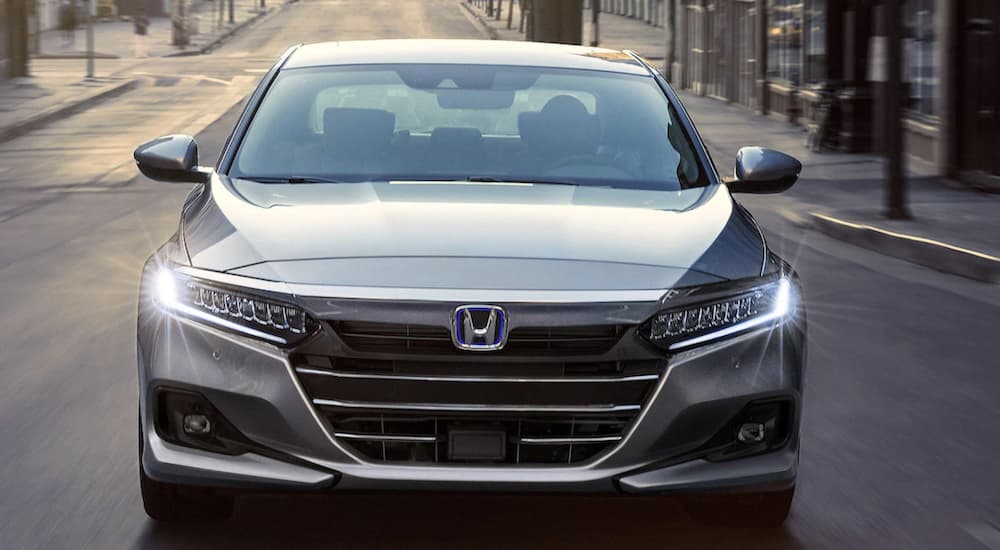 A silver 2022 Honda Accord Hybrid is shown from the front.