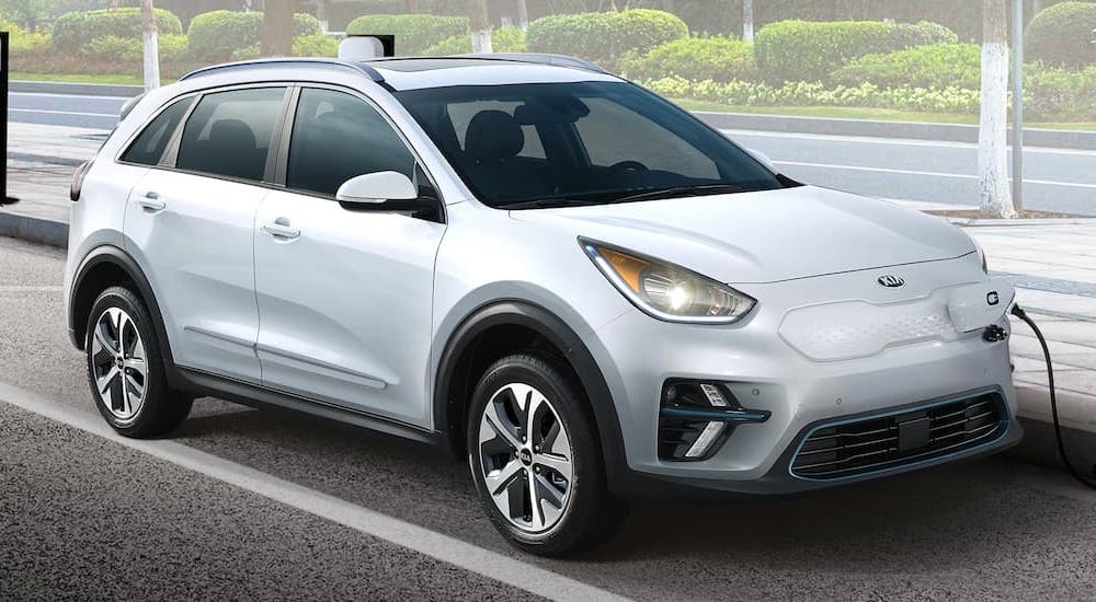 A white 2018 Kia Niro EV is shown after leaving a Kia dealer.