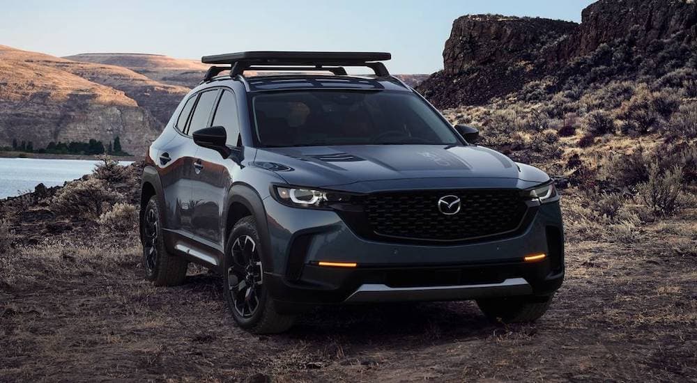 A 2022 Mazda CX-50 is shown from the front at an angle while parked offroad after the owner searched 'used Mazda dealership'.