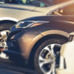 A row of cars are shown after searching "sell my car."